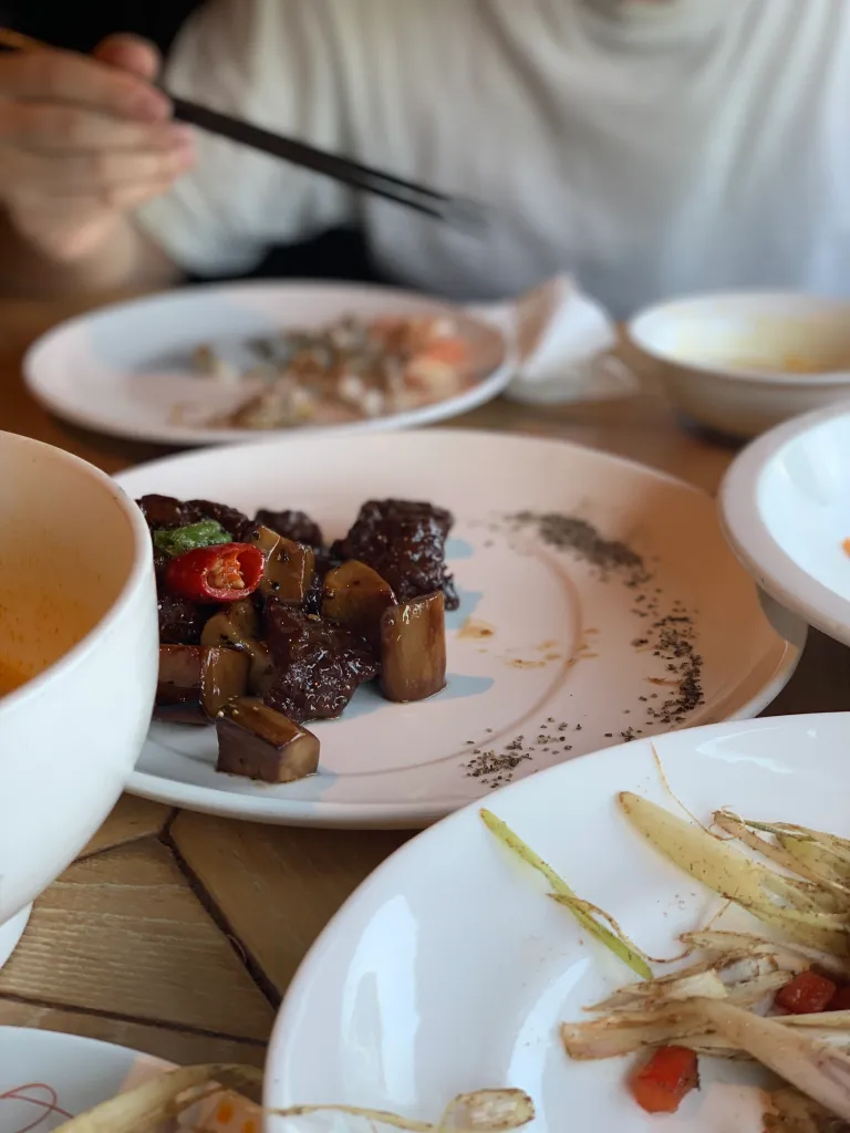 Shared dishes on a table during a meal