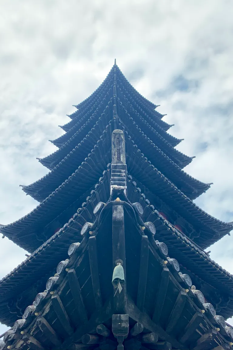 Upward view along the layered eaves of a traditional pagoda
