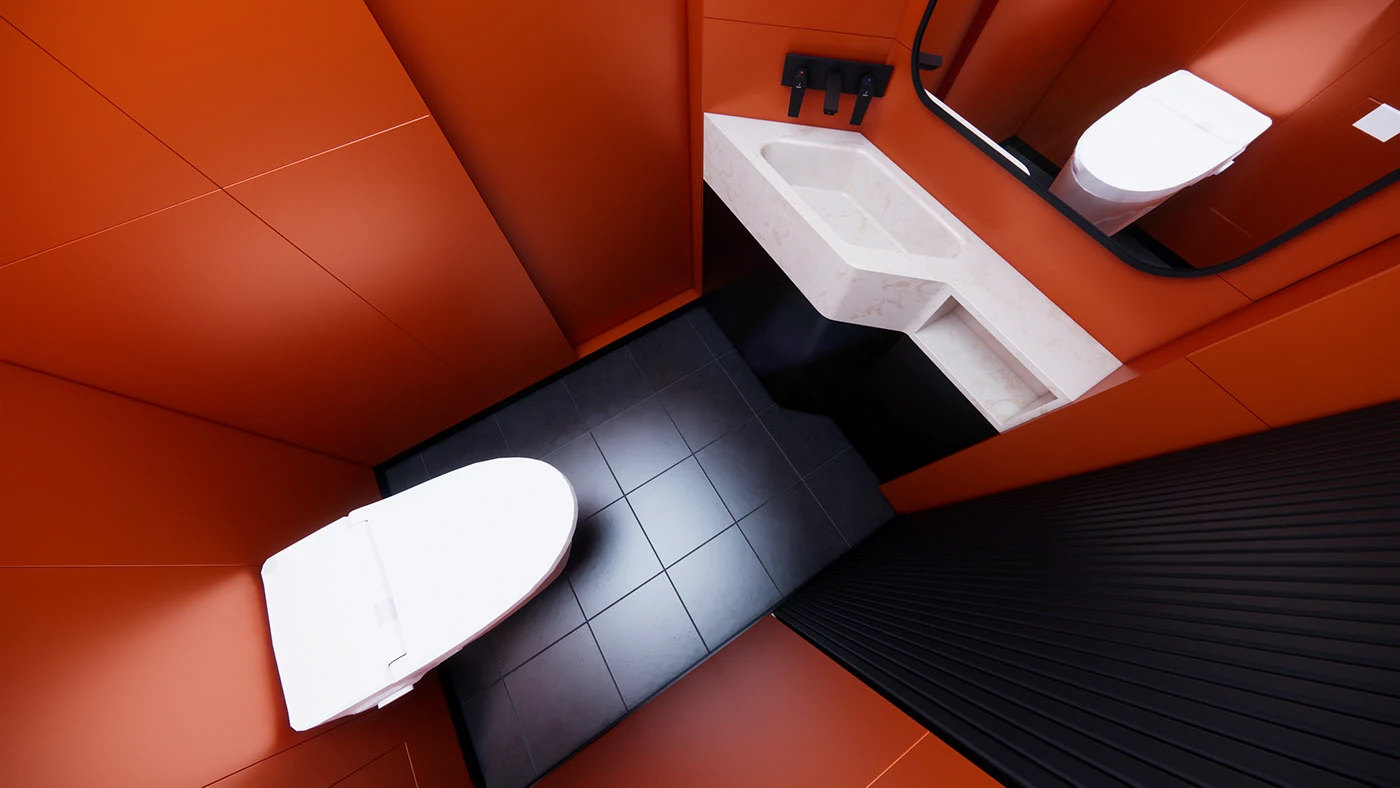 Overhead view of the compact orange-red restroom and black tiled floor